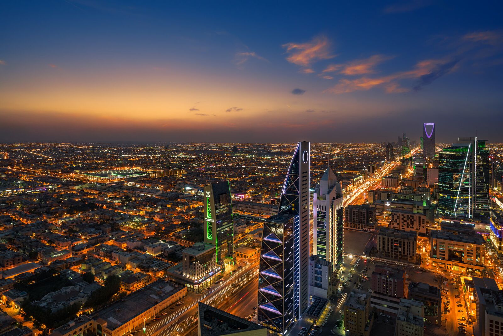 Riyadh at dusk with the Kingdom Centre and lit towers